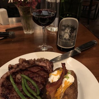 The Lone Buffalo Steakhouse - Bottle of wine and 12 oz ribeye - yum!! - Steakhouses Near Me - Dubois, Wyoming