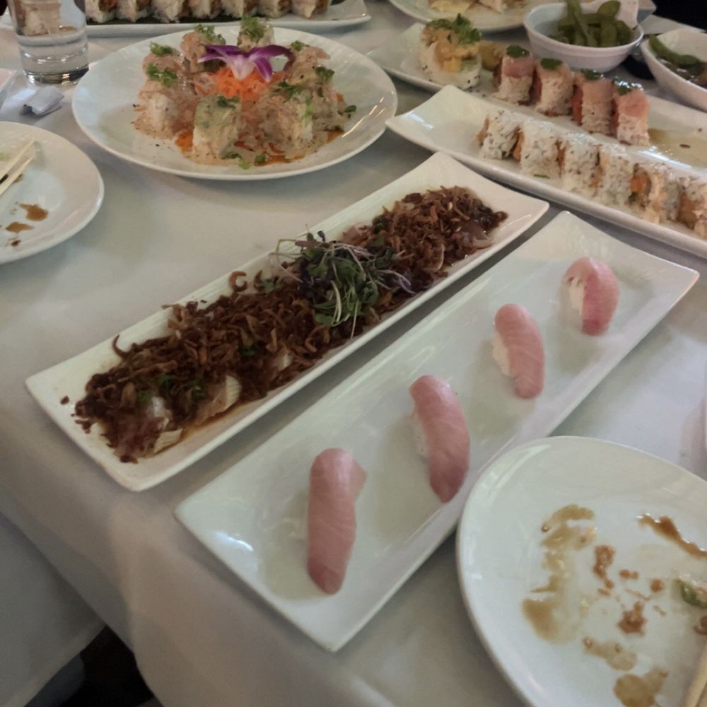 Teru Sushi - Albacore with Fried Onion (front left), roll dat yellowtail (back left), spicy scallop cut roll (middle right), sexy roll (middle left) - Sushi Bars Near Me - Studio City, California Teru Sushi - Albacore with Fried Onion (front left), roll dat yellowtail (back left), spicy scallop cut roll (middle right), sexy roll (middle left) - Sushi Bars Near Me - Studio City, California