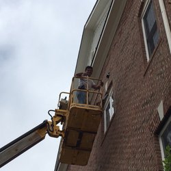 Homefront Insights - Man lift to caulk around exterior windows