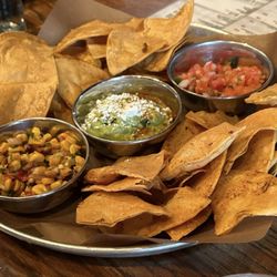 La Carnita - Nachos with guacamole, corn, and tomatillo salsa