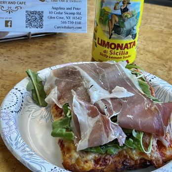 Curcio Bakery & Cafe - Pizza with prosciutto and arugula - Coffee & Tea Near Me - Glen Cove, New York Curcio Bakery & Cafe - Pizza with prosciutto and arugula - Coffee & Tea Near Me - Glen Cove, New York