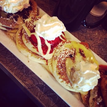 Toast - Pancake flight, done right! From left to right: chocolate banana, strawberry cheesecake, lemon blueberry, and peach berry. Mmmm! - Breakfast & Brunch Near Me - Littleton, Colorado