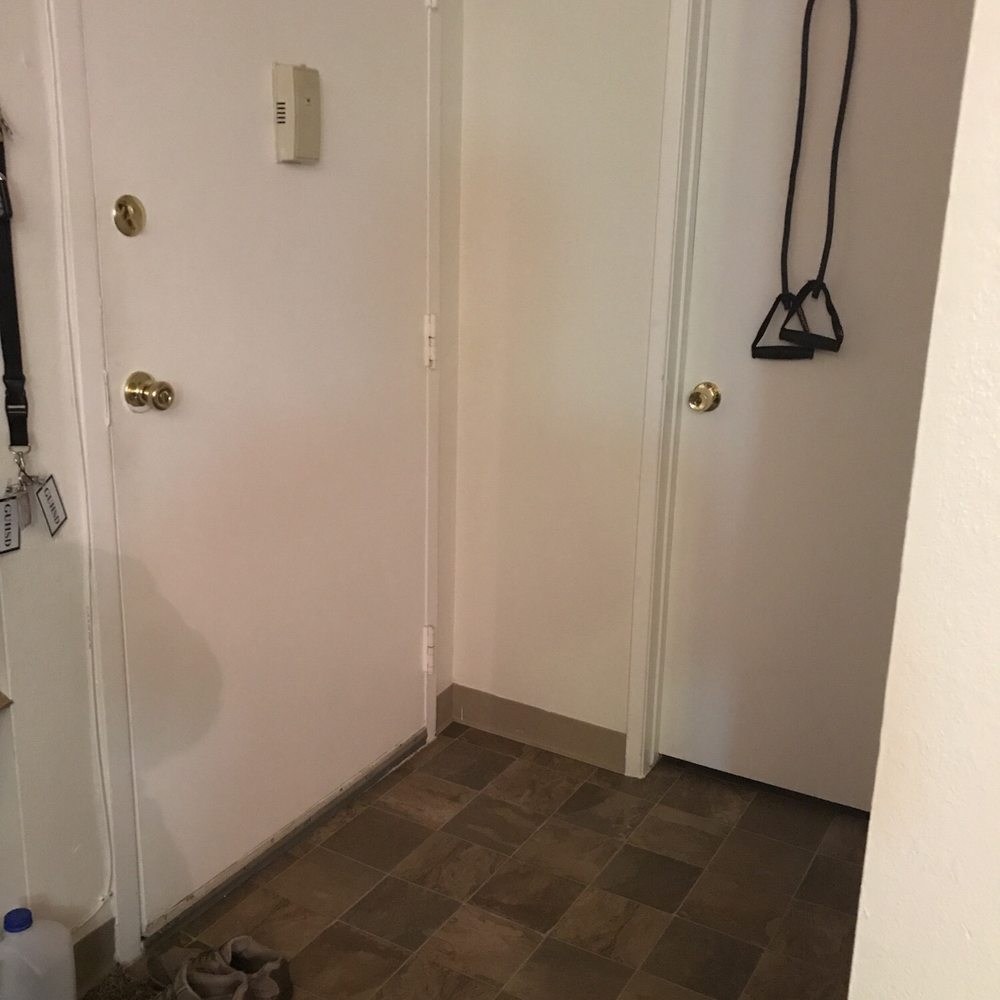 Chateau Spring Apartments - Tiled entry way and door to bathroom. The bathroom has two doors. - Apartments Near Me - La Mesa, California