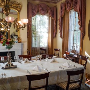 Restaurant 1818 - a formal dining room with a fireplace - New American Near Me - Natchez, Mississippi