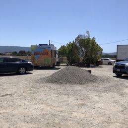a taco truck parked in a parking lot a taco truck parked in a parking lot