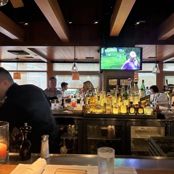 R+D Kitchen - Bar seating with TV view - New American Near Me - Newport Beach, California R+D Kitchen - Bar seating with TV view - New American Near Me - Newport Beach, California