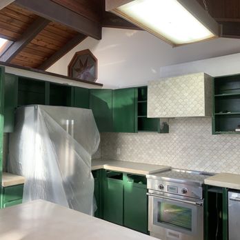 Triple L Contractor - a kitchen with green cabinets - General Contractors Near Me Triple L Contractor - a kitchen with green cabinets - General Contractors Near Me