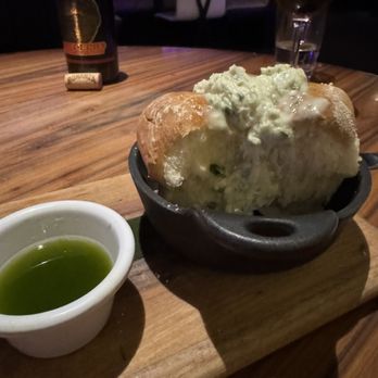 STK Steakhouse - House bread with herb butter and herb dipping sauce - Steakhouses Near Me - Chicago, Illinois STK Steakhouse - House bread with herb butter and herb dipping sauce - Steakhouses Near Me - Chicago, Illinois