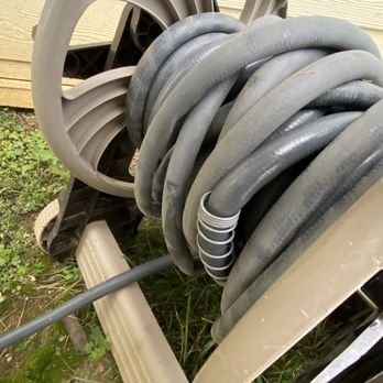 Waterside Apartments - Water hose at car wash station, also does not have a spray nozzle. - Apartments Near Me - Graham, North Carolina Waterside Apartments - Water hose at car wash station, also does not have a spray nozzle. - Apartments Near Me - Graham, North Carolina