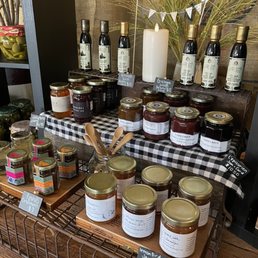 a display of various jars of olive oil a display of various jars of olive oil
