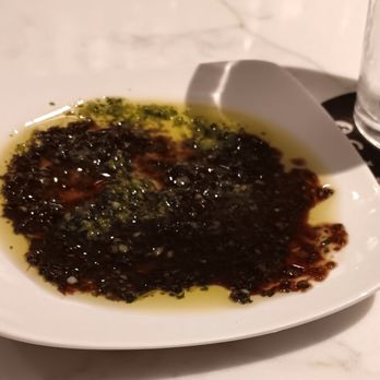 Woodside Grill - Dipping sauce for bread. Looks vile, tastes wonderfully herbal - Bars Near Me - Anderson, California