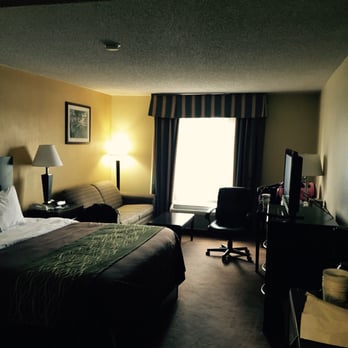 Comfort Inn University Area - King bed and living area..also has fridge and microwave - Hotels Near Me - Baton Rouge, Louisiana