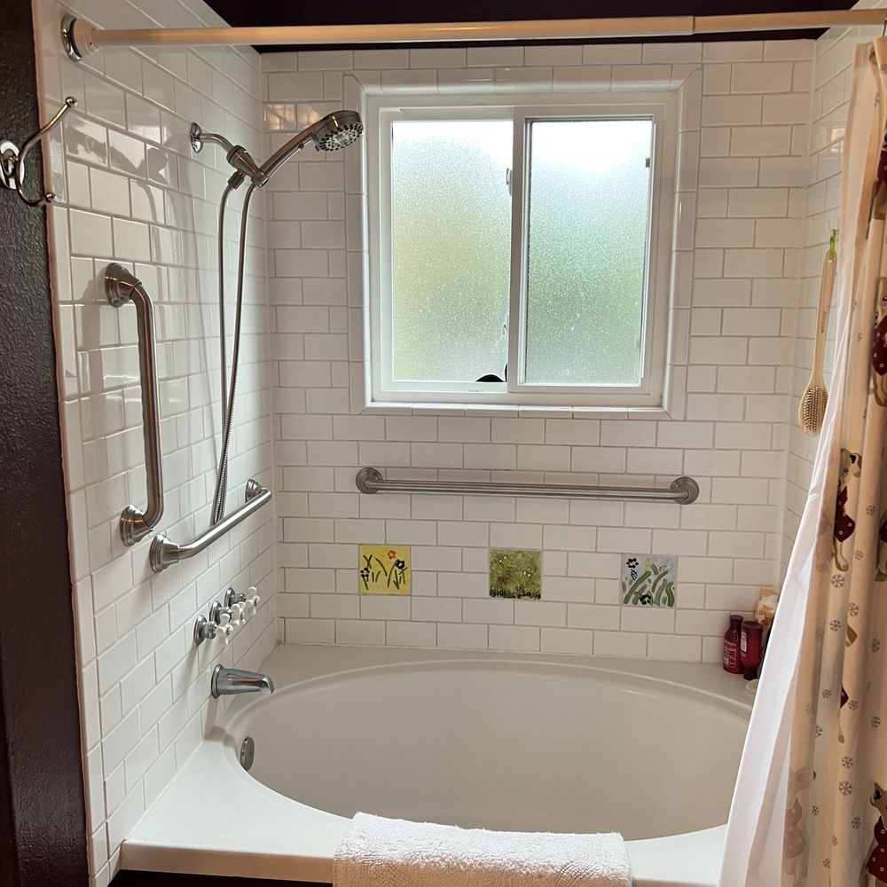 Three grab bars installed in shower/tub combo Three grab bars installed in shower/tub combo