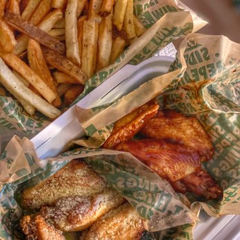 Wingstop - a basket of french fries and a basket of chicken - Chicken Wings Near Me - South San Francisco, California