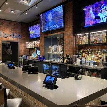 Chili's - a bar with a lot of tvs on the wall - American Near Me - Richmond, Texas