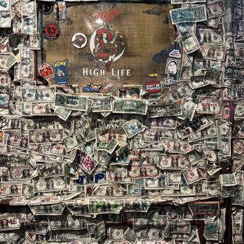 The Griffon - One of the numerous walls with dollar bills on them. - Pubs Near Me - Charleston, South Carolina