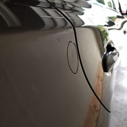 I'll post the after pic didn't get a chance to take one but see how tiny the dent is? He worked his magic on it !