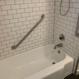 Looks like a brand new tub and the grab bars add much needed safety for our older parents