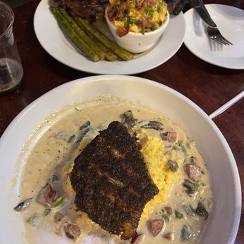 Churchill's - Ribeye with loaded mac-n-cheese and blackened snapper over cheddar grits with garlic and mushrooms. - Pubs Near Me - Savannah, Georgia Churchill's - Ribeye with loaded mac-n-cheese and blackened snapper over cheddar grits with garlic and mushrooms. - Pubs Near Me - Savannah, Georgia