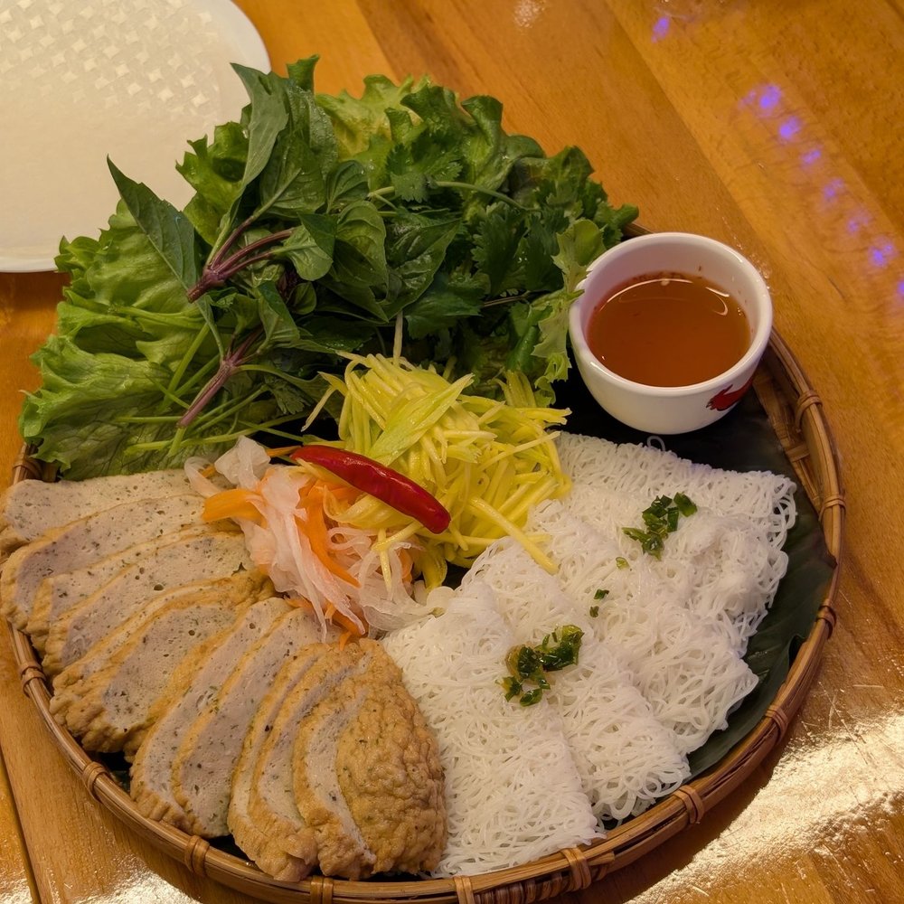 2025 Cafe - #29 bamboo tray with sliced fish cake, noodles, salad, mango, dipping sauce $16 - Vietnamese Near Me - Burnaby, British Columbia 2025 Cafe - #29 bamboo tray with sliced fish cake, noodles, salad, mango, dipping sauce $16 - Vietnamese Near Me - Burnaby, British Columbia