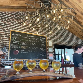 Oak & Apple Cidery - two women at a bar - Cideries Near Me - Penfield, New York Oak & Apple Cidery - two women at a bar - Cideries Near Me - Penfield, New York