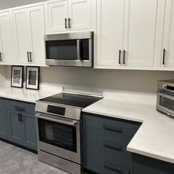 Vermont Home Center - Custom cabinet and countertop installation with Bosch induction range and OTR