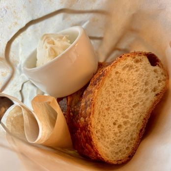 Bistro Boudin - Bread (Complimentary). Crust is crispy w/ a deep golden appearance, while the interior is moist & chewy. Tangy in flavor. So satisfying. - Bakeries Near Me - San Francisco, California Bistro Boudin - Bread (Complimentary). Crust is crispy w/ a deep golden appearance, while the interior is moist & chewy. Tangy in flavor. So satisfying. - Bakeries Near Me - San Francisco, California