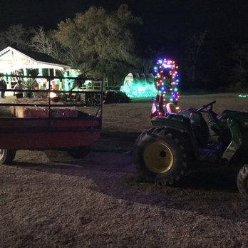Old West Christmas Light Fest - The hay wagon all swagged out - Festivals Near Me - Boerne, Texas