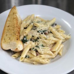 Back Home Restaurant & Catering - Chicken & spinach Alfredo - chicken, fresh spinach, bacon, fresh garlic, cream, shaved parmesan, penne + garlic toast