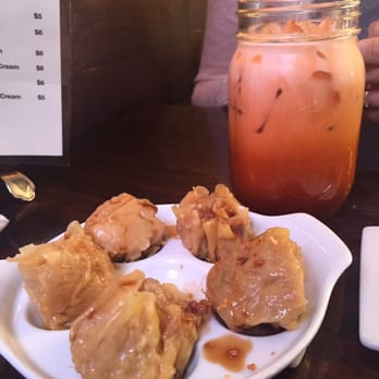 Spicy Shallot - Steamed Dumplings with Garlic Soy Sauceeeee (a fave) and Thai Iced Tea. - Thai Near Me - Elmhurst, New York Spicy Shallot - Steamed Dumplings with Garlic Soy Sauceeeee (a fave) and Thai Iced Tea. - Thai Near Me - Elmhurst, New York