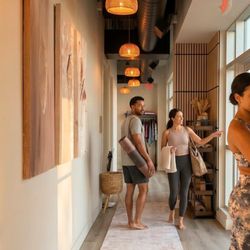 Goji Yoga & Wellness - Members near the front area of Goji Yoga & Wellness in Oakville, showing the warm and welcoming studio entry experience.