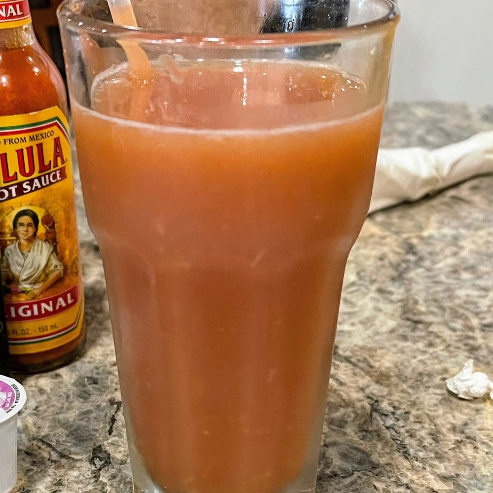 Scrambles Cafe - a glass of orange juice with a straw - Breakfast & Brunch Near Me - Ocala, Florida Scrambles Cafe - a glass of orange juice with a straw - Breakfast & Brunch Near Me - Ocala, Florida