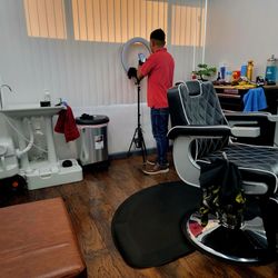 Chay's Barber - Basic but new with a clean set up. Comfortably air conditioned. Parking in the back.