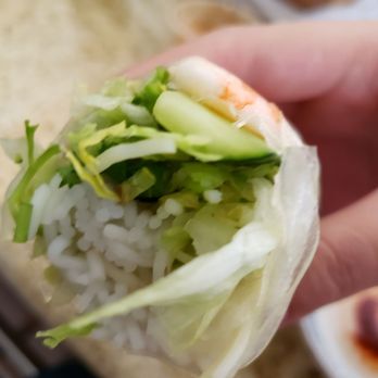 Boba Tea House - a hand holding a piece of food - Vietnamese Near Me - Long Beach, California Boba Tea House - a hand holding a piece of food - Vietnamese Near Me - Long Beach, California
