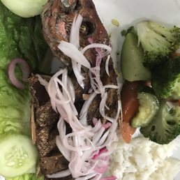 Whole fried snapper with marinated onions. Good stuff! Whole fried snapper with marinated onions. Good stuff!