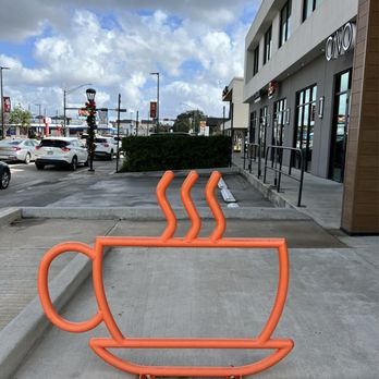 Cavo Coffee - a cup of coffee on a bike rack - Coffee & Tea Near Me - Houston, Texas