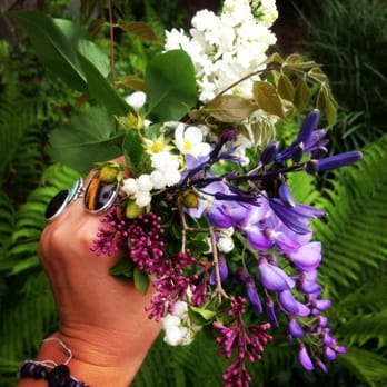 Gayle Gardens - a hand holding a bunch of flowers - Landscaping Near Me Gayle Gardens - a hand holding a bunch of flowers - Landscaping Near Me