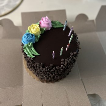Tilda's Bake Shop - a chocolate cake with flowers and candles - Bakeries Near Me - Rocky Point, New York Tilda's Bake Shop - a chocolate cake with flowers and candles - Bakeries Near Me - Rocky Point, New York