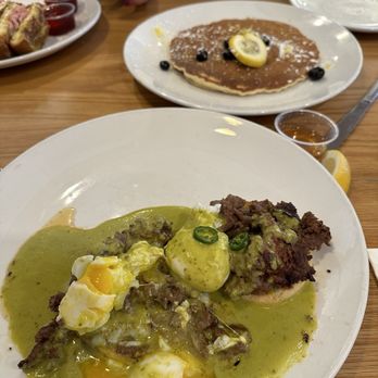 Broken Yolk Cafe - The Border Benedict and Lemon Ricotta pancake. - American Near Me - Temecula, California Broken Yolk Cafe - The Border Benedict and Lemon Ricotta pancake. - American Near Me - Temecula, California