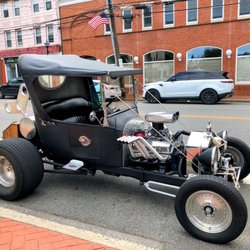 Town of Oyster Bay - Car parked on street near TR Bully Bar .