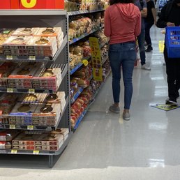 people shopping in a grocery store people shopping in a grocery store