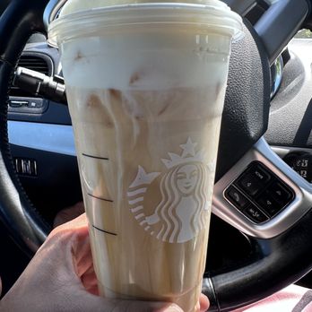 Starbucks - a hand holding a cup of iced coffee - Coffee & Tea Near Me - Charlotte, North Carolina Starbucks - a hand holding a cup of iced coffee - Coffee & Tea Near Me - Charlotte, North Carolina
