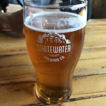 Whitewater Brewing - a glass of beer on a table - Breweries Near Me - Cobden, Ontario Whitewater Brewing - a glass of beer on a table - Breweries Near Me - Cobden, Ontario