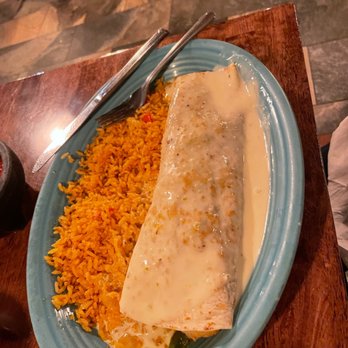 Wild Burrito - This was my mom's delectable shrimp fajita burrito. She absolutely loves it. - Bars Near Me - Madison, Ohio Wild Burrito - This was my mom's delectable shrimp fajita burrito. She absolutely loves it. - Bars Near Me - Madison, Ohio