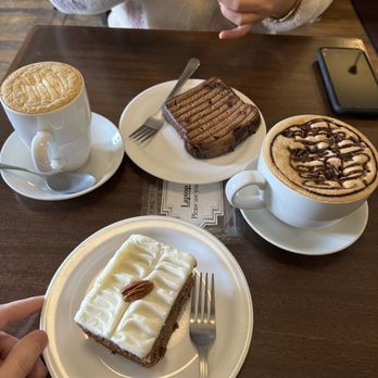Bean Around the World Coffees - a woman eating a piece of cake - Coffee & Tea Near Me - Vancouver, British Columbia Bean Around the World Coffees - a woman eating a piece of cake - Coffee & Tea Near Me - Vancouver, British Columbia