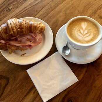 Panther Coffee - Ham and cheese croissant with latte. - Coffee & Tea Near Me - Miami Beach, Florida