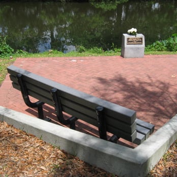 Audubon Park - This seating area commemorates a person who passed away at a young age and was an aficionado of the park.  There is a wreath. - Parks Near Me - New Orleans, Louisiana