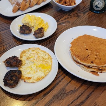 Another Broken Egg Cafe - French toast, eggs, house-made sausage patties. Side of house potatoes. Pancakes, eggs and house-made sausage and a side of grits. - Cafes Near Me - Atlanta, Georgia