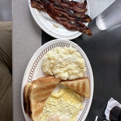Waffle House - Eggs over medium, grits with a side of crunchy bacon (as I order it). I like to put bacon in my grits