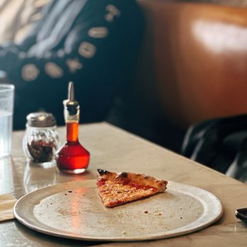 Milkflower - Spicy oil and chili flakes with a slice of queen pizza (IG: cafetash) - Pizza Near Me - Astoria, New York